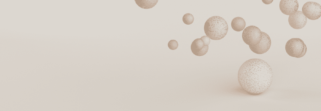 A series of 3d spheres hover over a larger sphere. Website symbol for anxiety.